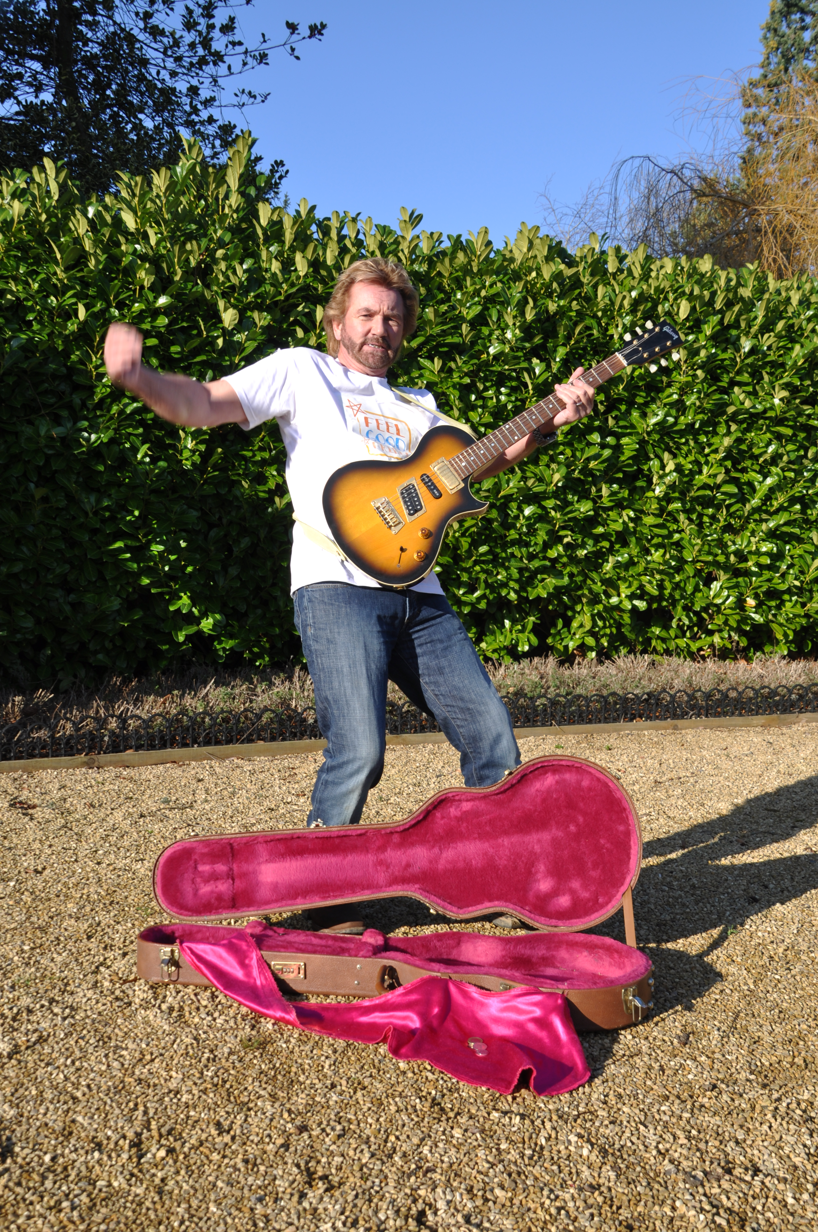 Noel Edmonds playing guitar for a Samaritans PR shoot. Copyright Palamedes PR