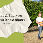 TV star Noel Edmonds holding a guitar and pretending to play in aid of a PR stunt by Palamedes for Samaritans